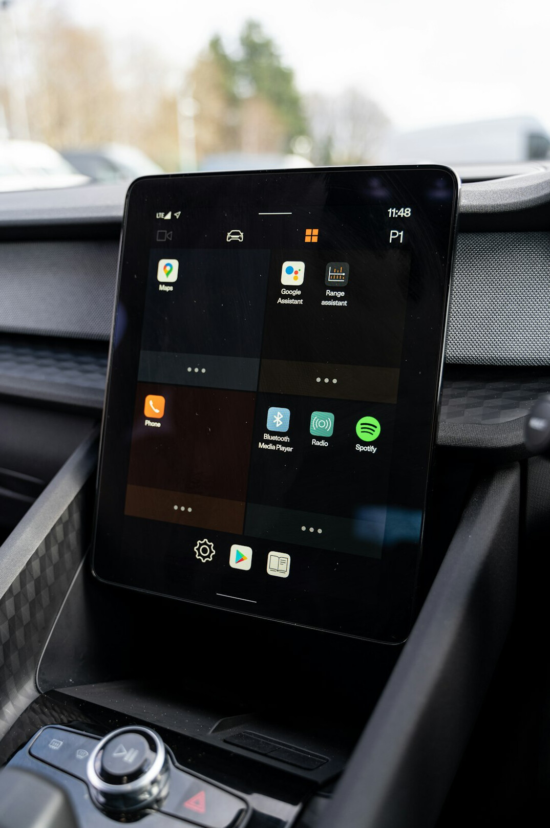 Tablet with analytics dashboard on a white desk next to a ceramic cup